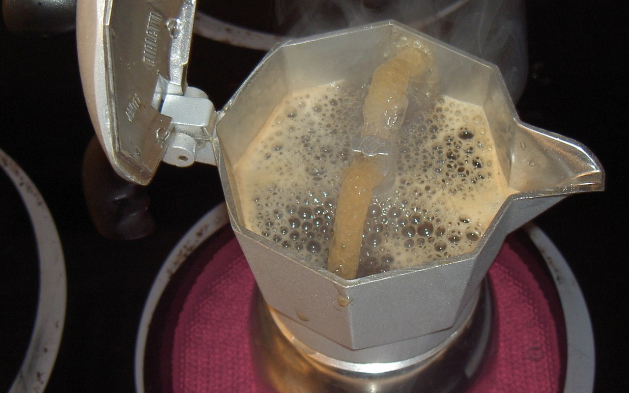 Bialetti Moka Express brewing on a stove